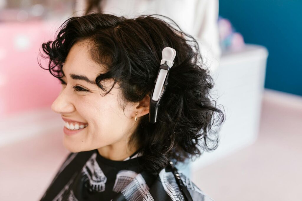 Curly Haired Woman with Crocodile Hair Clip