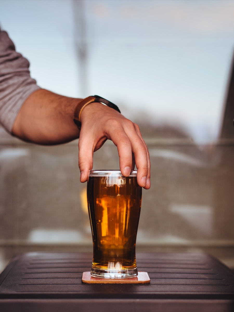 person holding glass cup